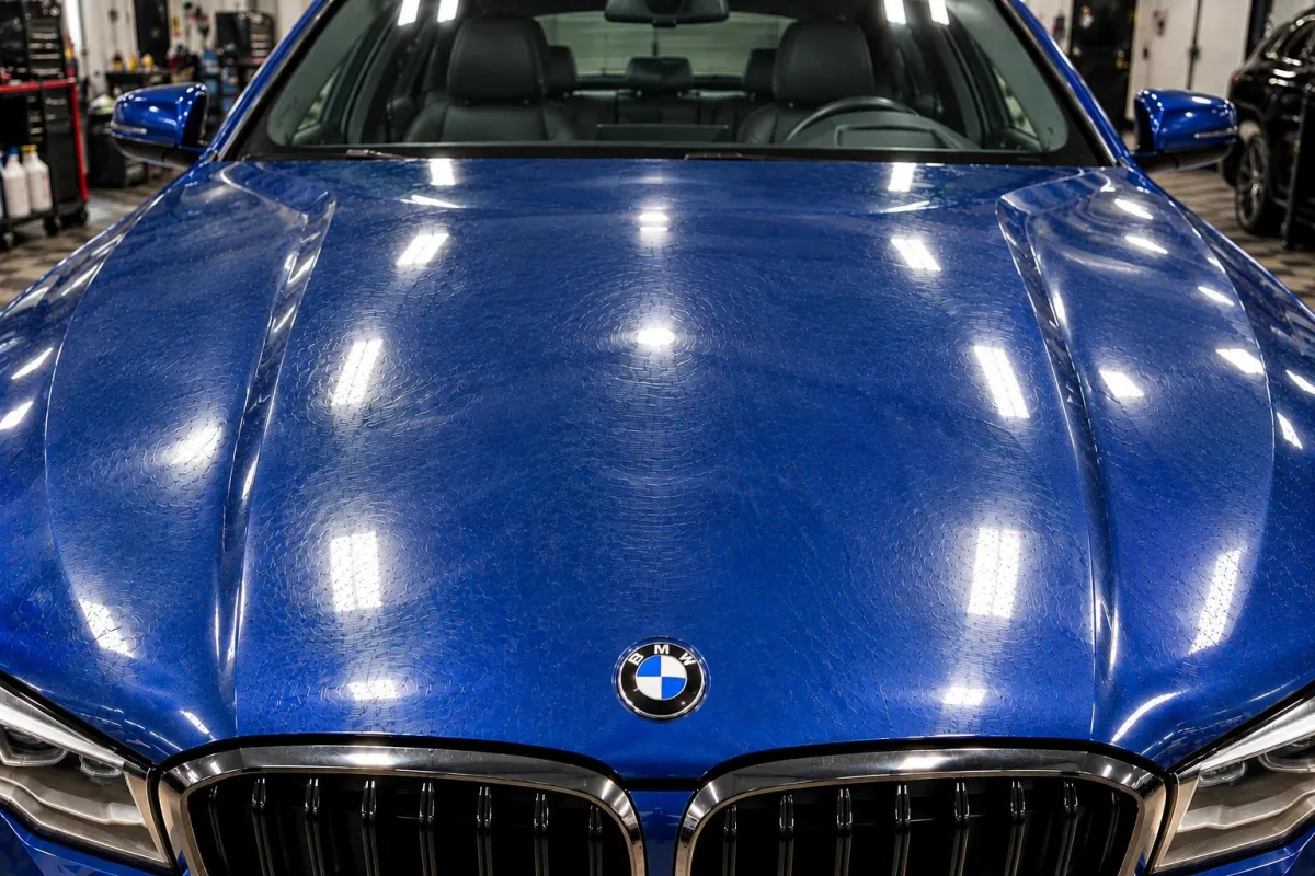 BMW hood before paint correction, covered in swirl marks